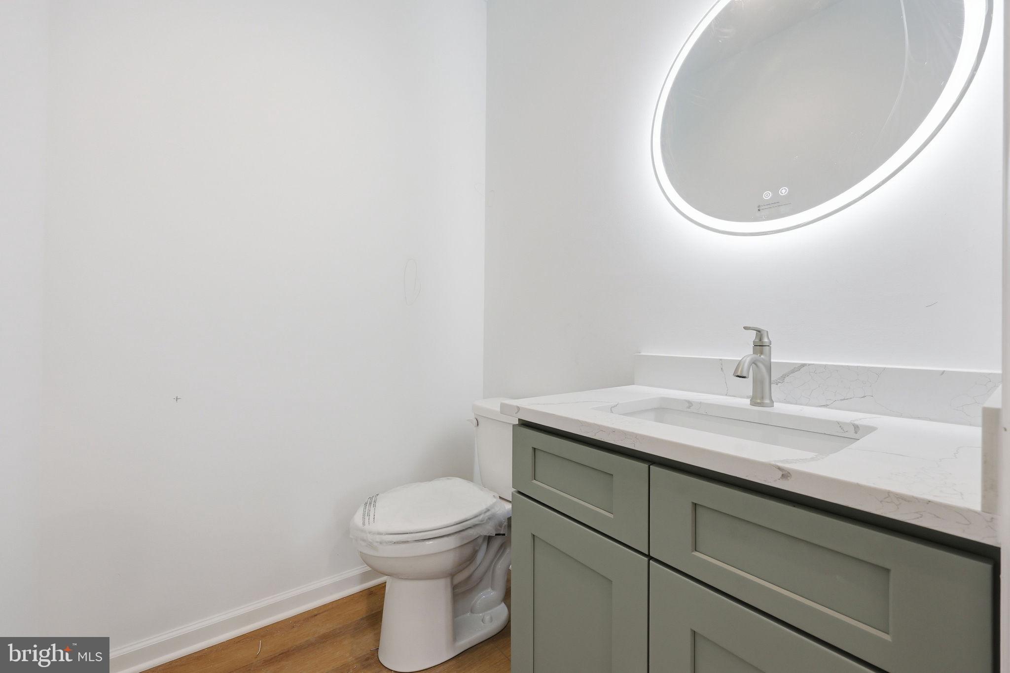 10339 Back Creek Valley Road Hedgesville, WV 25427 - Photo 18 of 48 a bathroom with a toilet and a sink