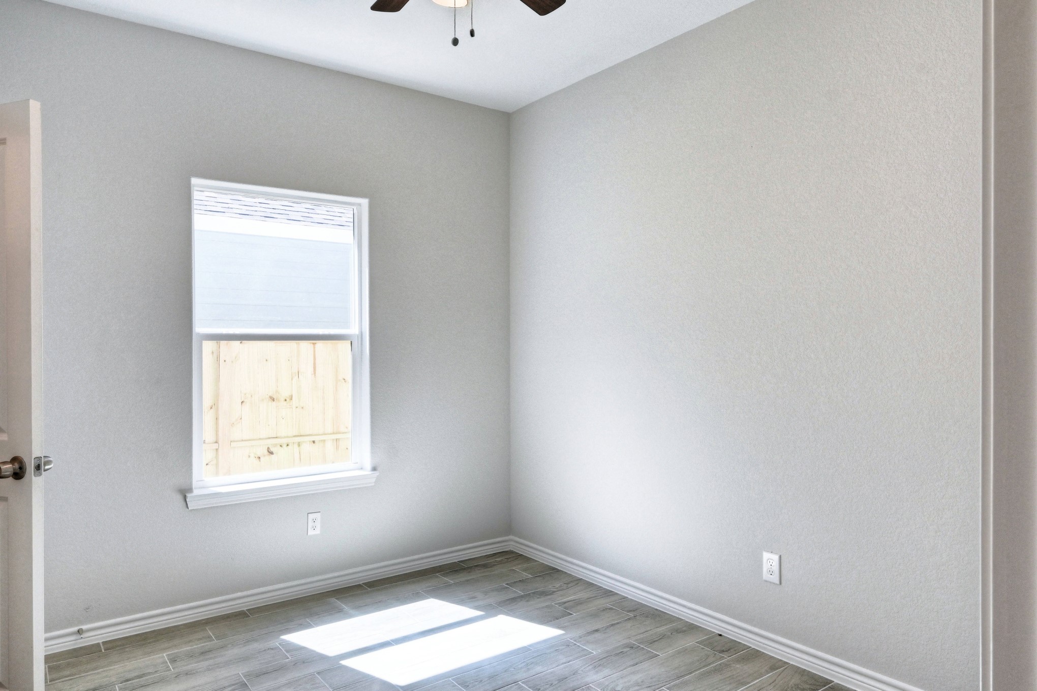 9812 Arbor Oak Willis, TX 77318 - Photo 13 of 40 an empty room with a window