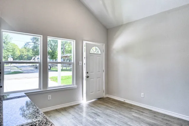 a view of an empty room with a window