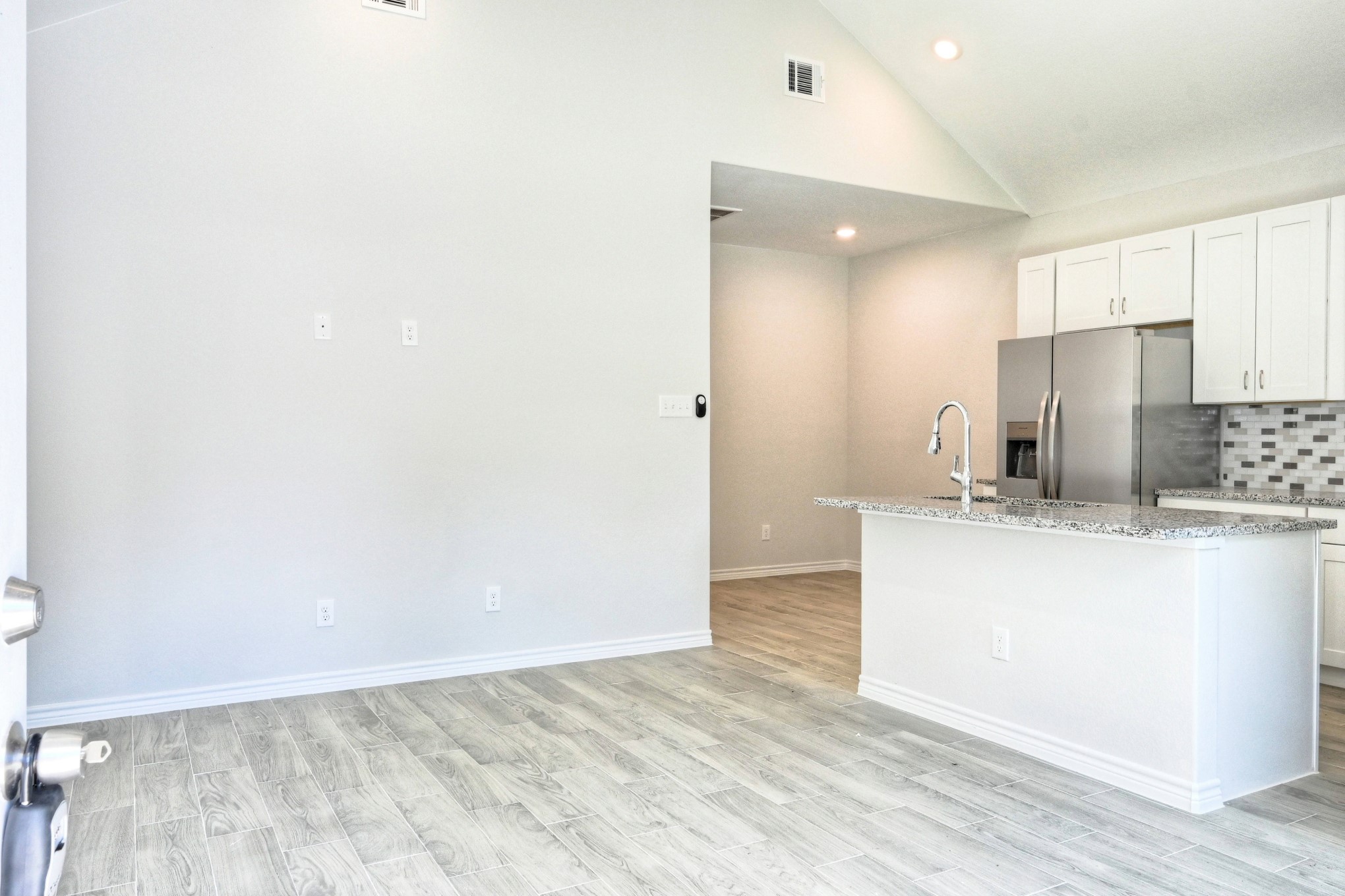 9812 Arbor Oak Willis, TX 77318 - Photo 3 of 40 a view of kitchen with refrigerator sink and wooden floor