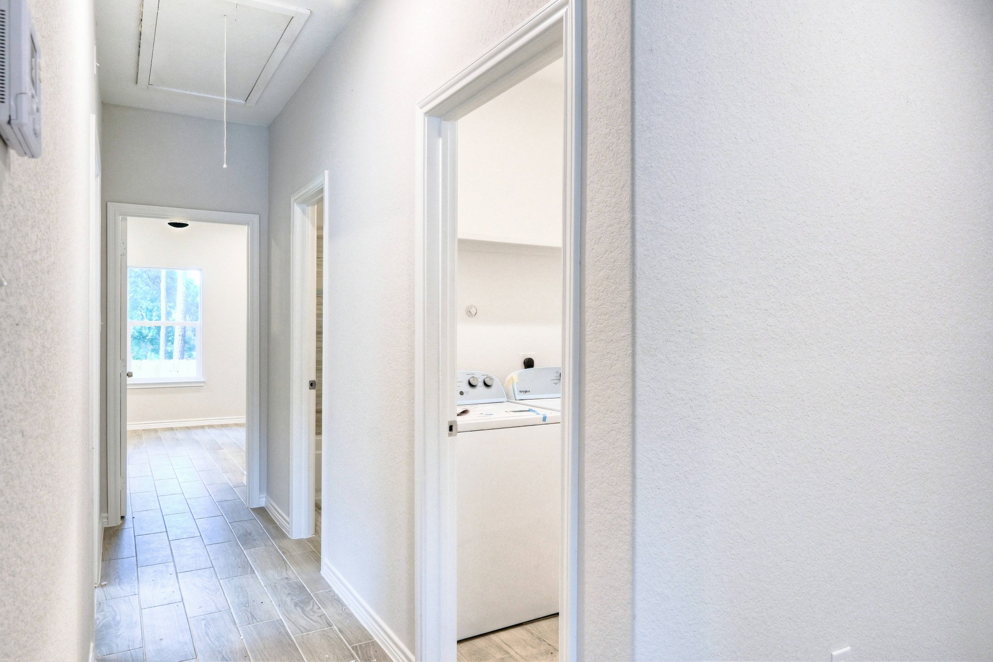 9812 Arbor Oak Willis, TX 77318 - Photo 10 of 40 a view of a hallway with wooden floor