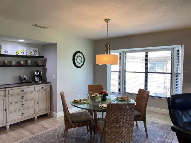 a view of a dining room with furniture window and outside view
