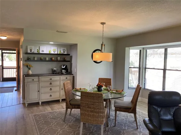 a dining room with furniture and window
