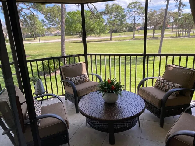 a view of a porch with furniture