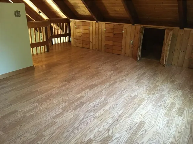 a living room with furniture fireplace and a large window