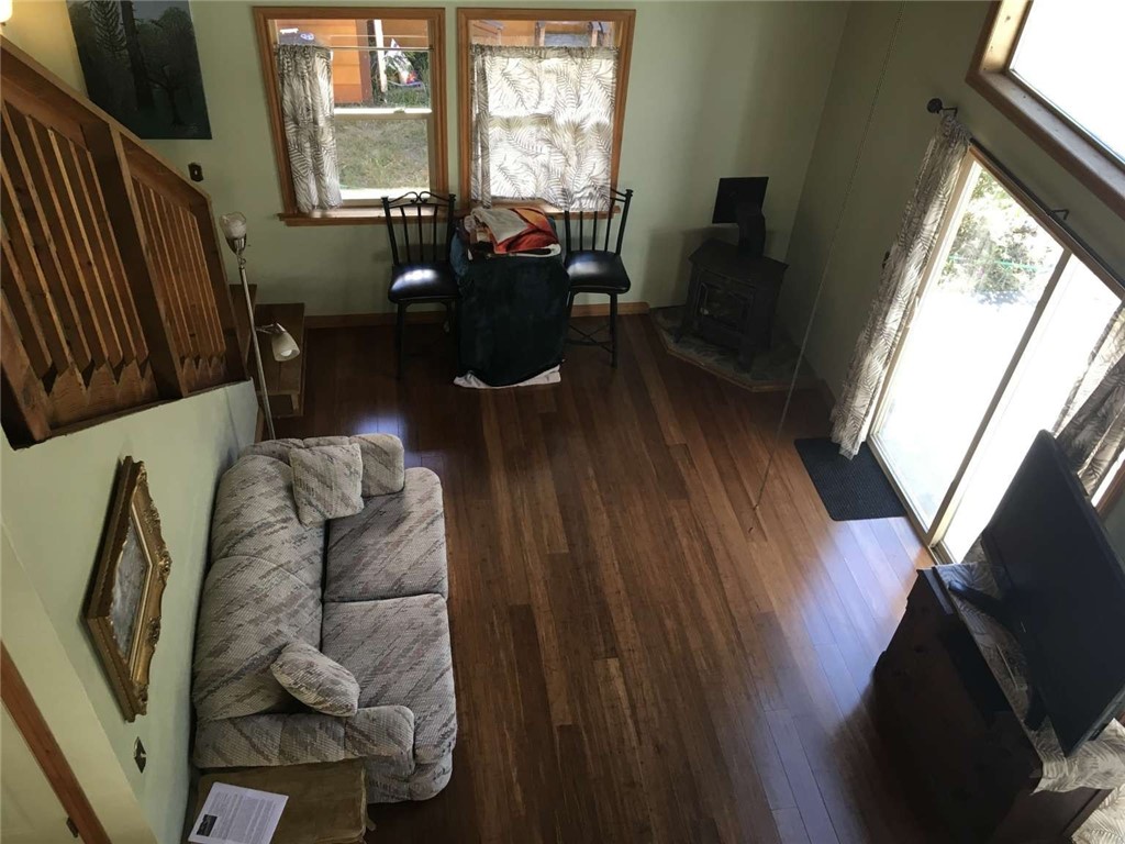 5001 Highway 299 Burnt Ranch, CA 95527 - Photo 22 of 25 a living room with furniture fireplace and a large window