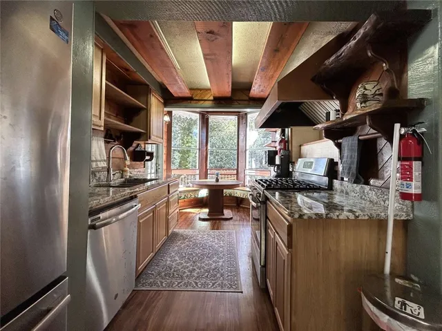 a kitchen with stainless steel appliances granite countertop lots of counter top space