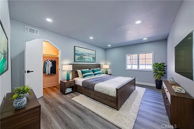 a kitchen with stainless steel appliances a stove top oven and a refrigerator