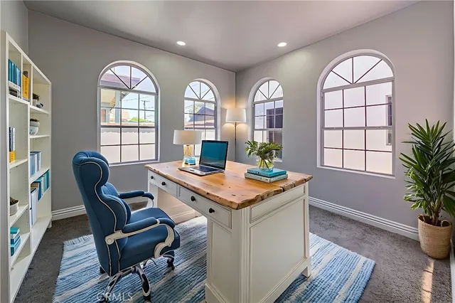 a large bedroom with bed and tv