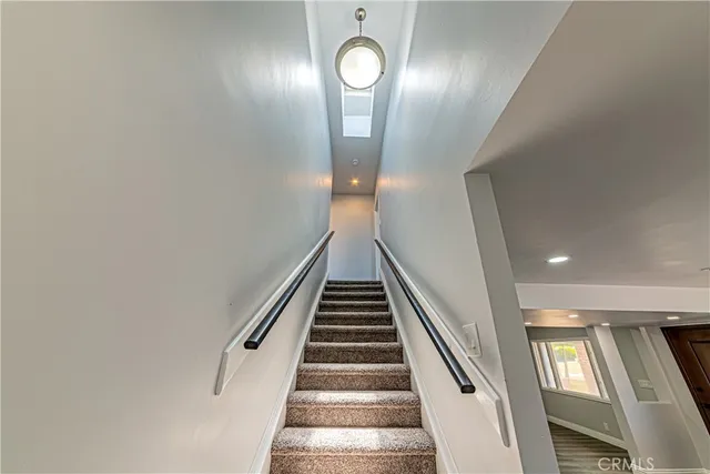 a spacious bedroom with a bed and a couch