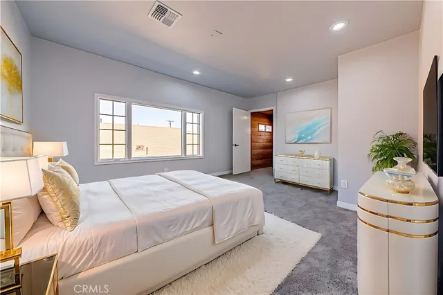 a front view of a house with basket ball court and a garage