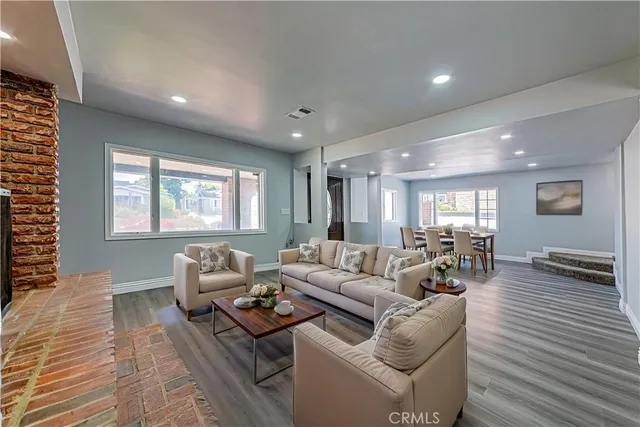 a living room with furniture and a table
