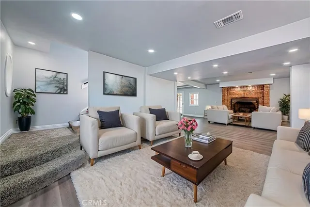 a bedroom with a large bed and a flat screen tv