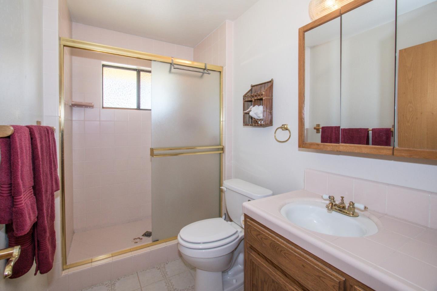 105 Mountain View Road Watsonville, CA 95076 - Photo 15 of 26 a bathroom with a sink toilet and shower