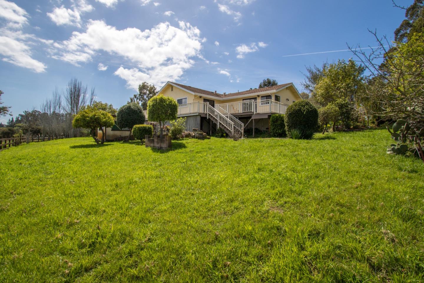 105 Mountain View Road Watsonville, CA 95076 - Photo 5 of 26 a view of a house with backyard and garden