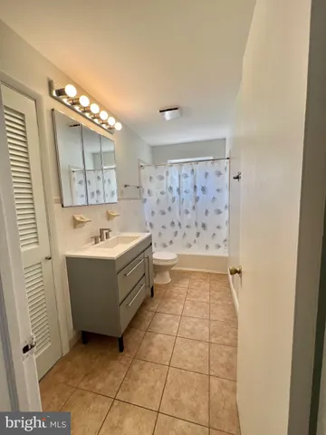 a bathroom with a sink a mirror and a bathtub