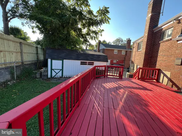 a balcony with wooden floor and furniture