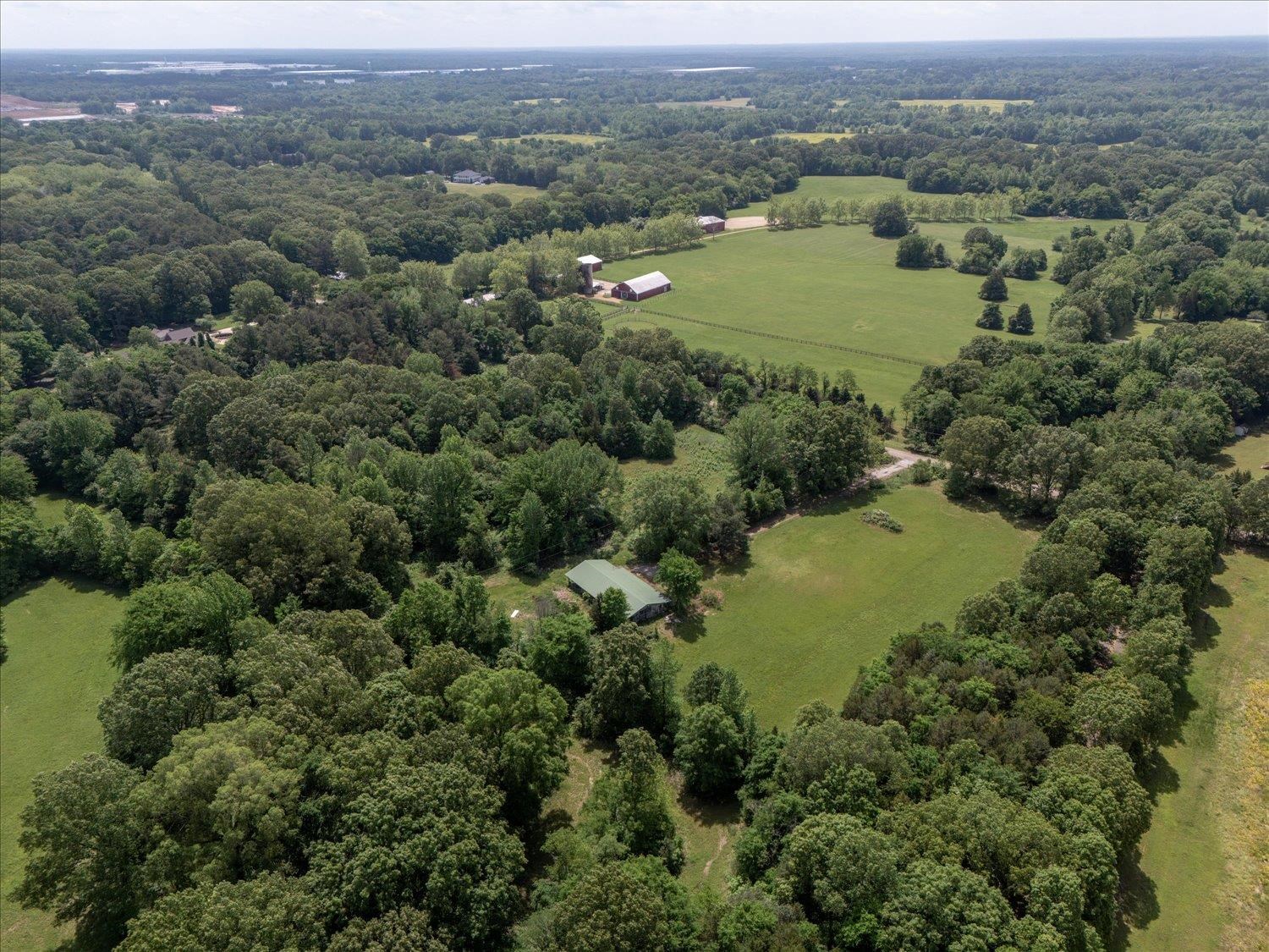 11620 East Holmes Road Collierville, TN 38017 - Photo 11 of 28 Drone / aerial view featuring a wooded view and a rural view