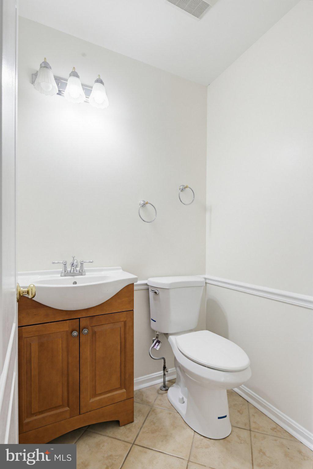 3641 Branhum Road Edgewater, MD 21037 - Photo 42 of 63 a bathroom with a toilet a sink and mirror