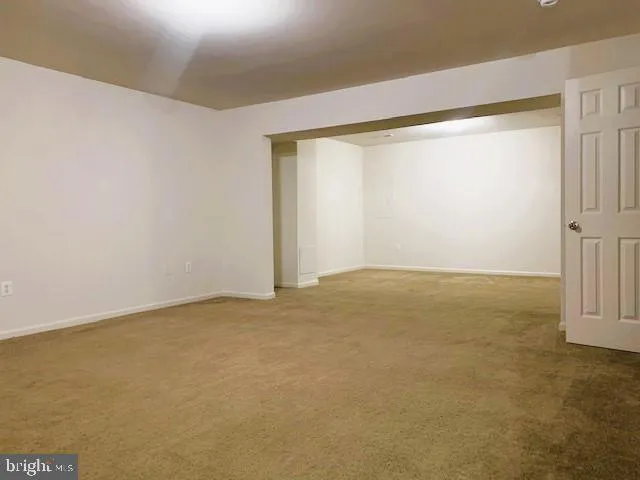 an empty room with a empty space and a window
