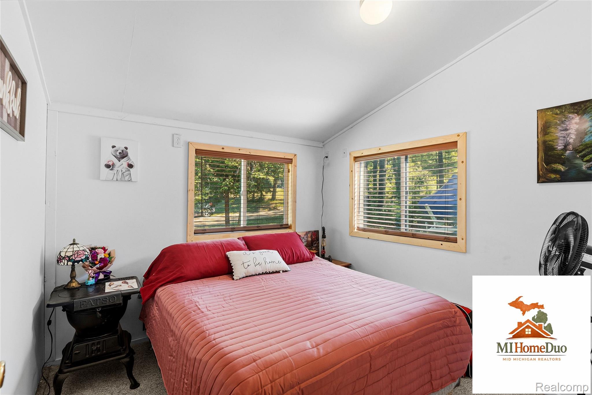 6960 Rumsay Street Harrison, MI 48625 - Photo 23 of 29 Vaulted ceilings with a flush mount light fixture