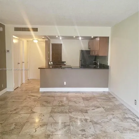 a view of a kitchen with a sink