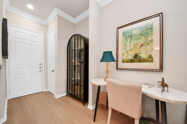 a view of hall way with furniture and a window