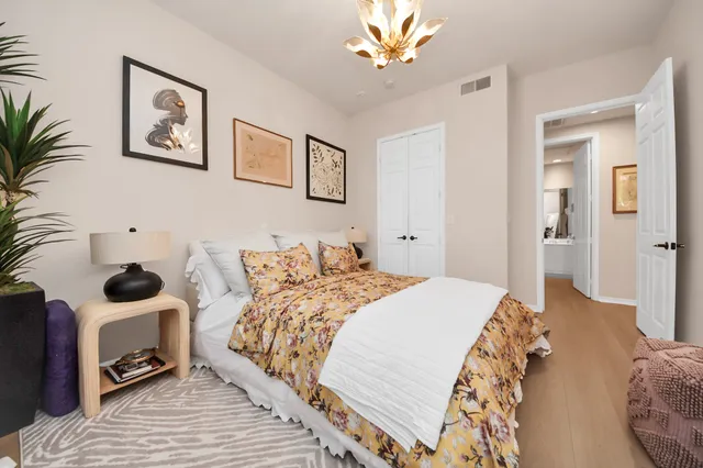 a bedroom with a bed and a view of bathroom