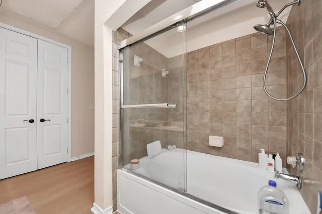 a bathroom with a bath tub and shower