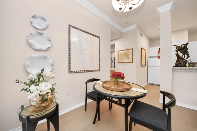a workspace room with furniture and wooden floor