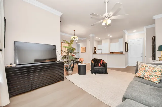 a room with furniture and a flat screen tv