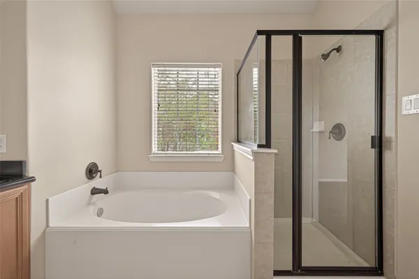 a white bath tub sitting next to a window