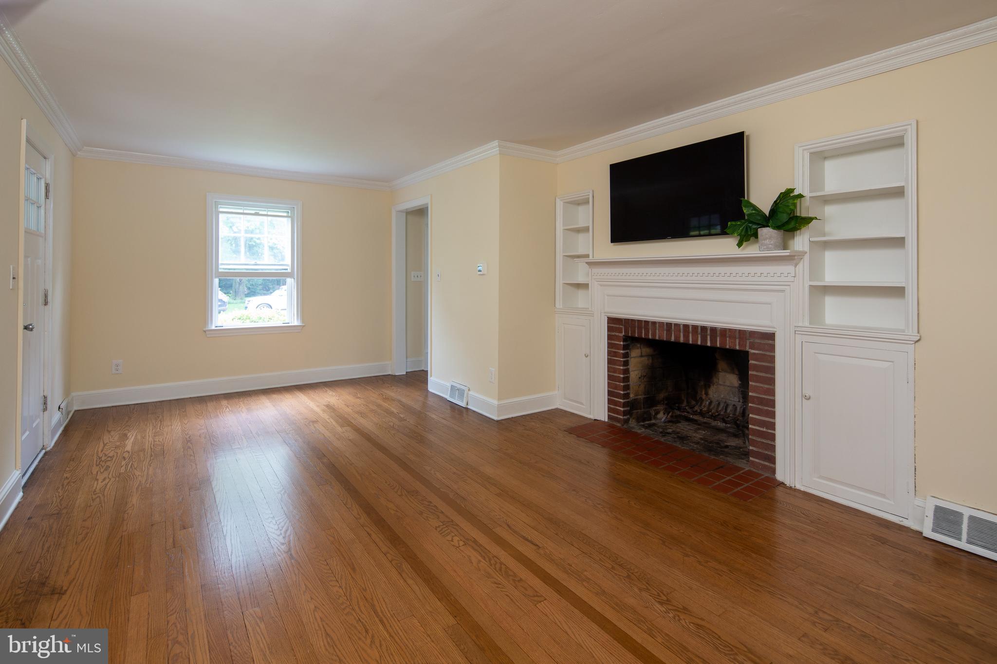 Spacious living room with access to screened porch