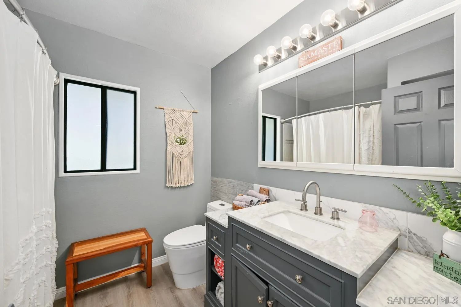 26138 Jesmond Dene Road Escondido, CA 92026 - Photo 16 of 34 a bathroom with a sink and a mirror