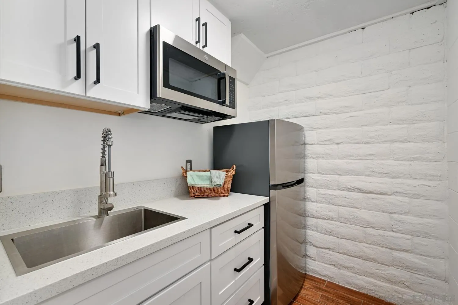 26138 Jesmond Dene Road Escondido, CA 92026 - Photo 19 of 34 a kitchen with stainless steel appliances white cabinets and a sink