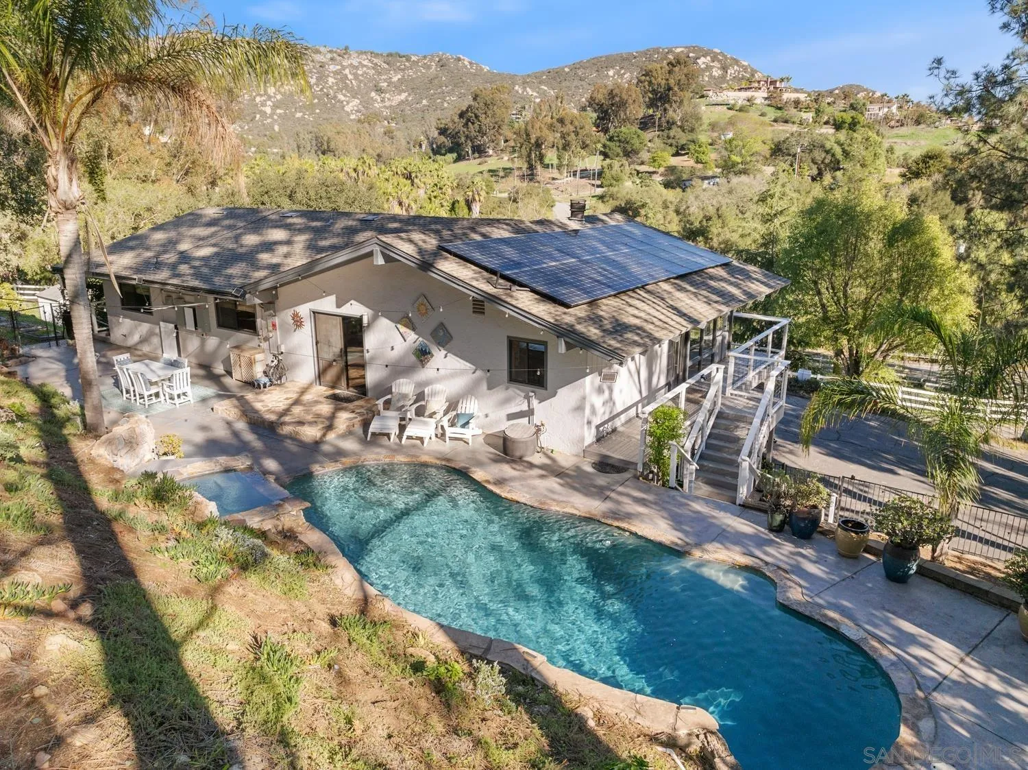 26138 Jesmond Dene Road Escondido, CA 92026 - Photo 26 of 34 a view of a backyard with sitting area