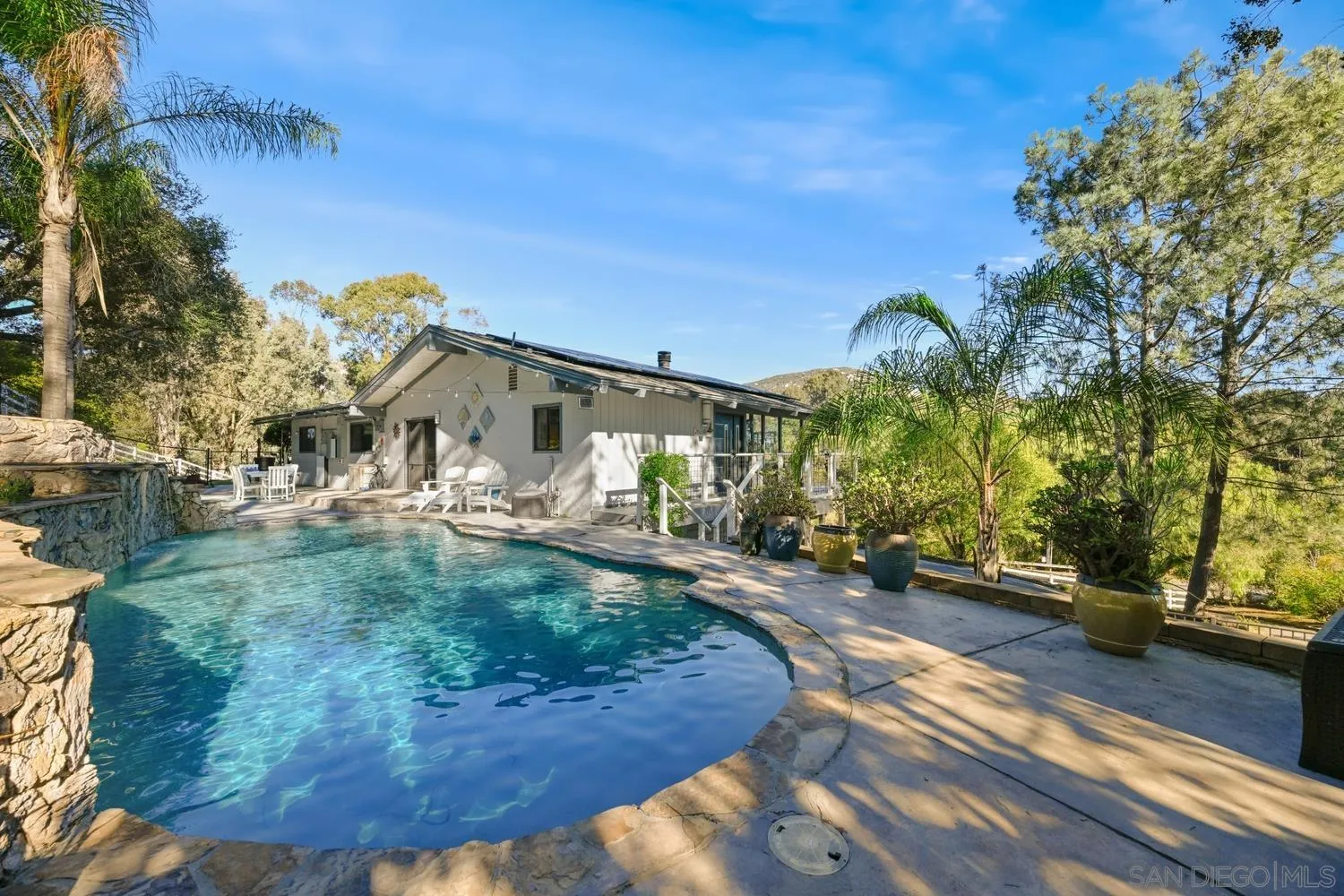 26138 Jesmond Dene Road Escondido, CA 92026 - Photo 27 of 34 a view of a house with basketball court