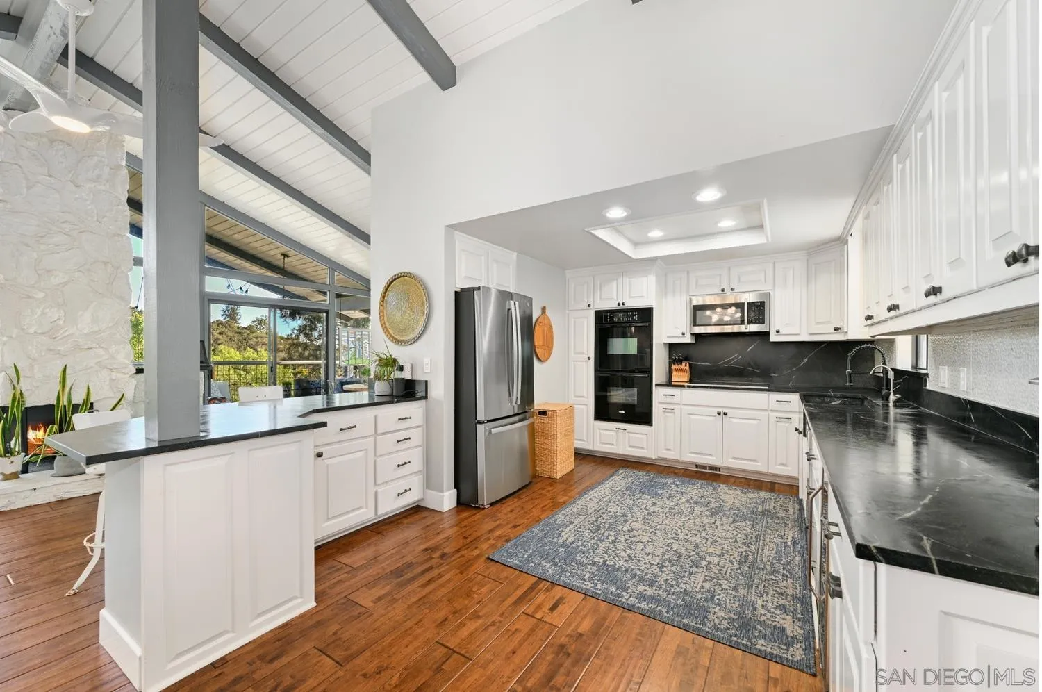 26138 Jesmond Dene Road Escondido, CA 92026 - Photo 5 of 34 a large kitchen with stainless steel appliances granite countertop a large counter top and a stove