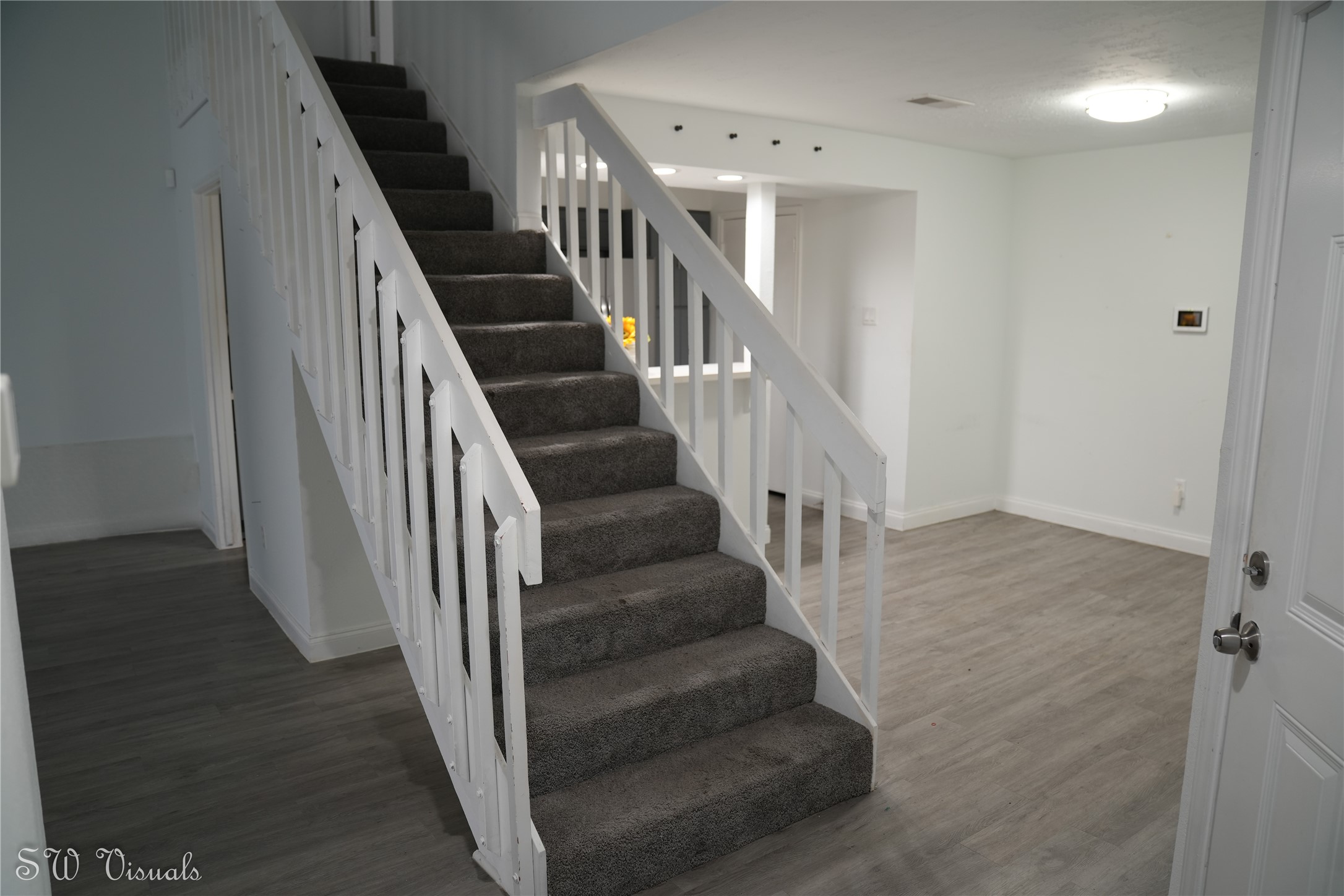 8803 Vinkins Road Houston, TX 77071 - Photo 3 of 13 a view of entryway and hall with wooden floor