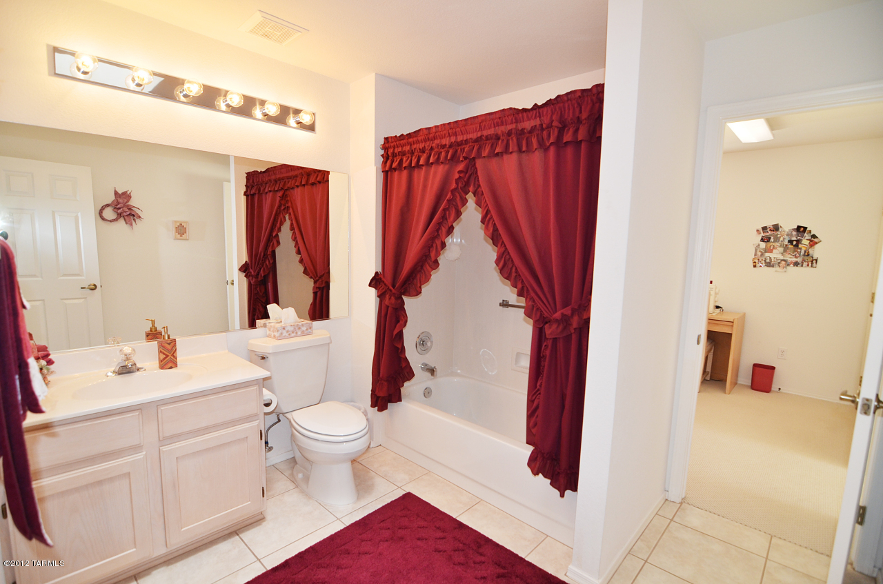 1330 East Crown Ridge Drive Tucson, AZ 85755 - Photo 15 of 22 a bathroom with a sink a toilet and a shower