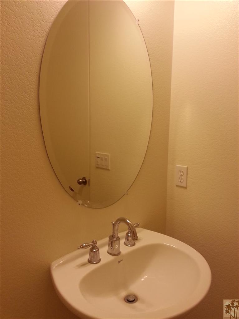 60143 Range View Drive Palm Springs, CA 92262 - Photo 9 of 11 a bathroom with a sink and mirror