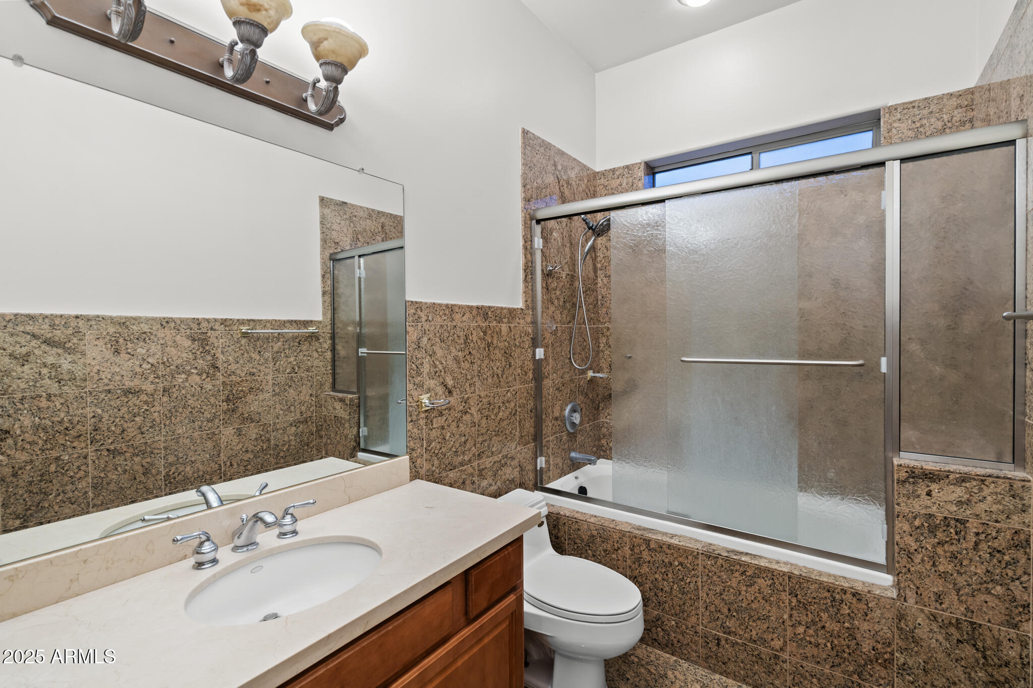 6829 North 14th Street Phoenix, AZ 85014 - Photo 27 of 53 a bathroom with a sink mirror toilet and shower
