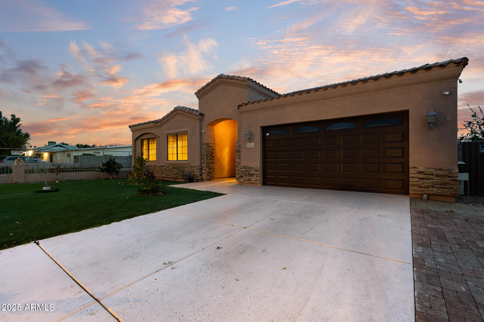 6829 North 14th Street Phoenix, AZ 85014 - Photo 2 of 53 a front view of a house with a yard and garage