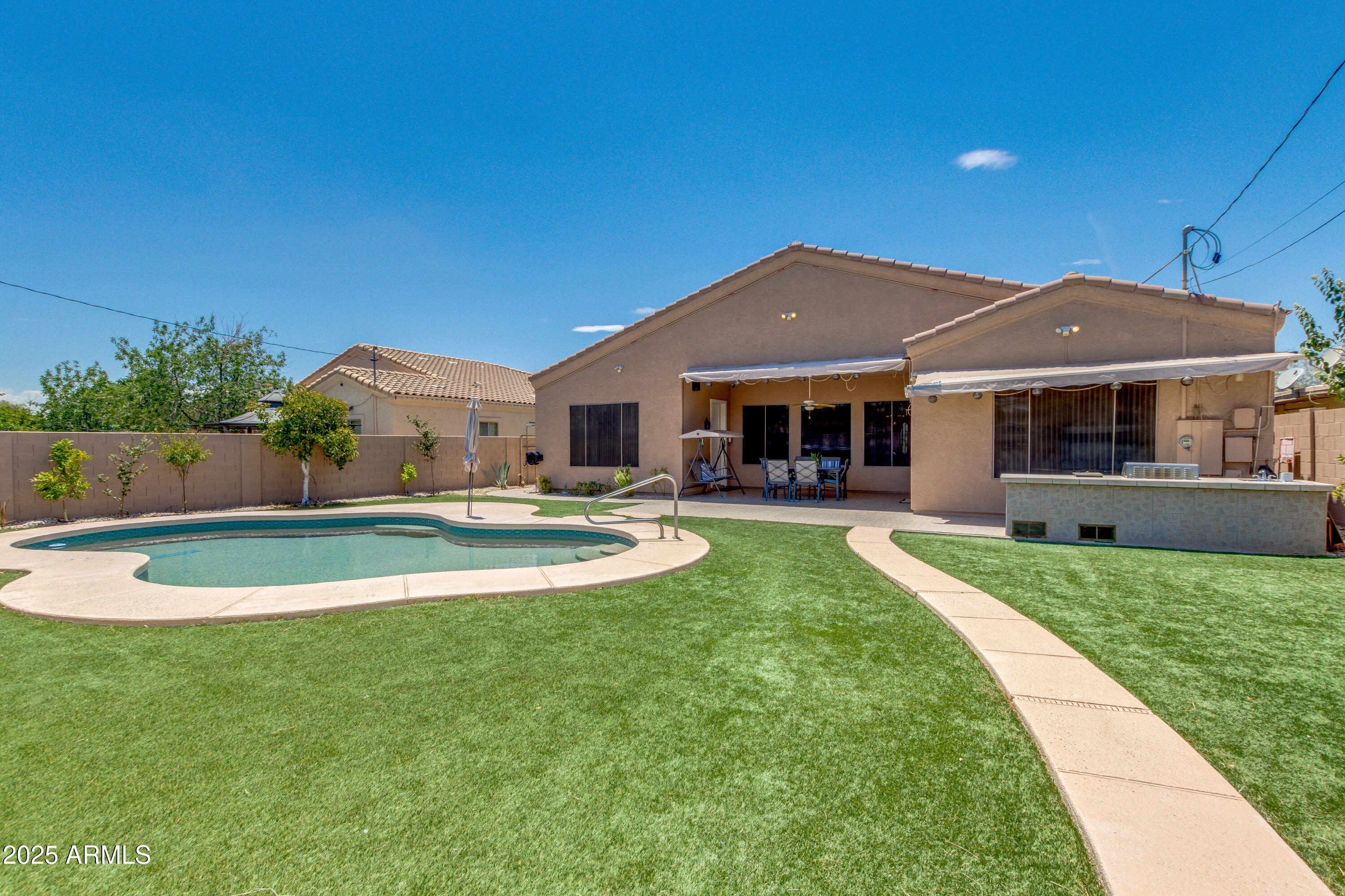 6829 North 14th Street Phoenix, AZ 85014 - Photo 41 of 53 a view of a house with a swimming pool