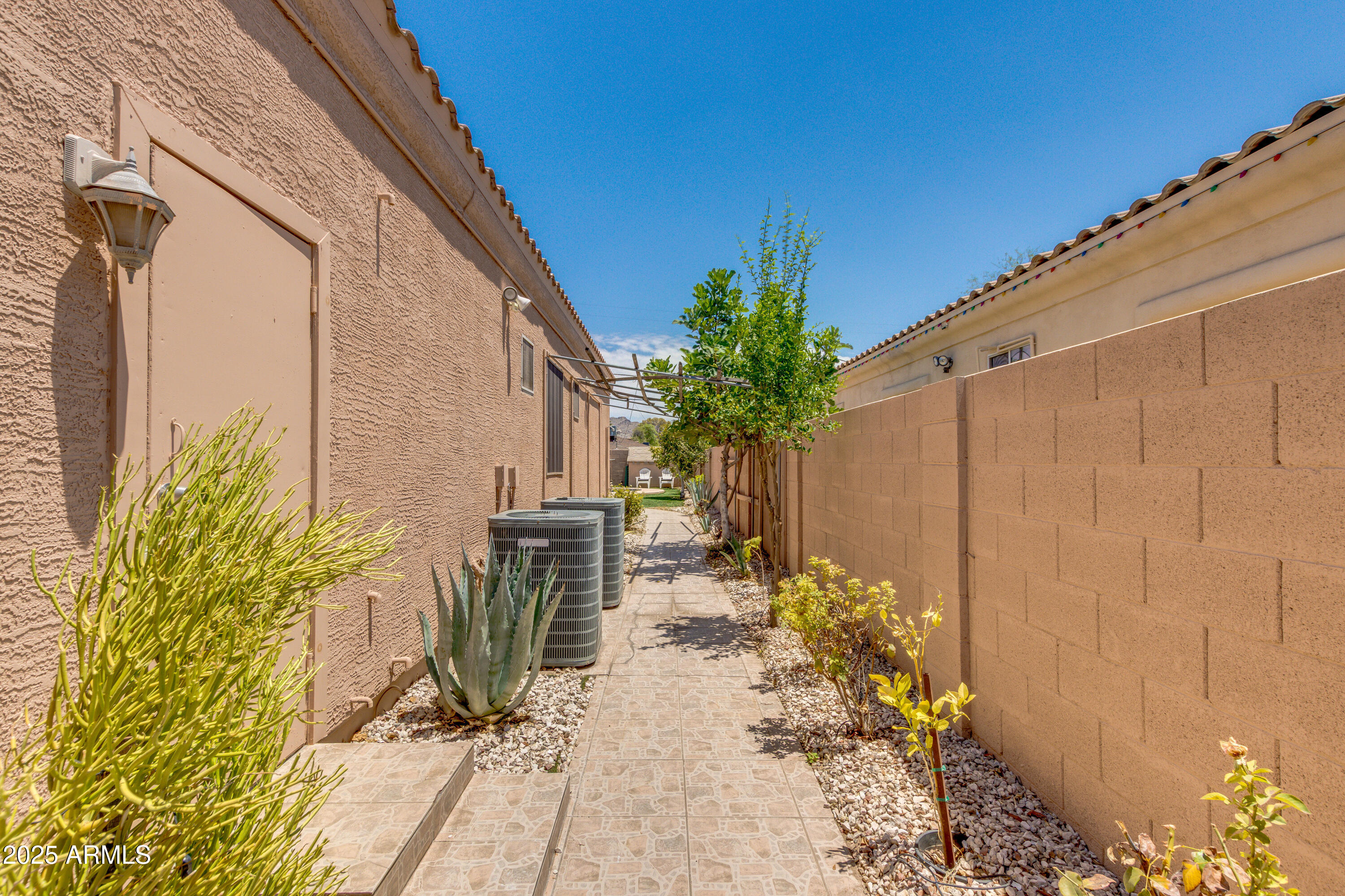 6829 North 14th Street Phoenix, AZ 85014 - Photo 7 of 53 a view of a porch with chairs and potted plants
