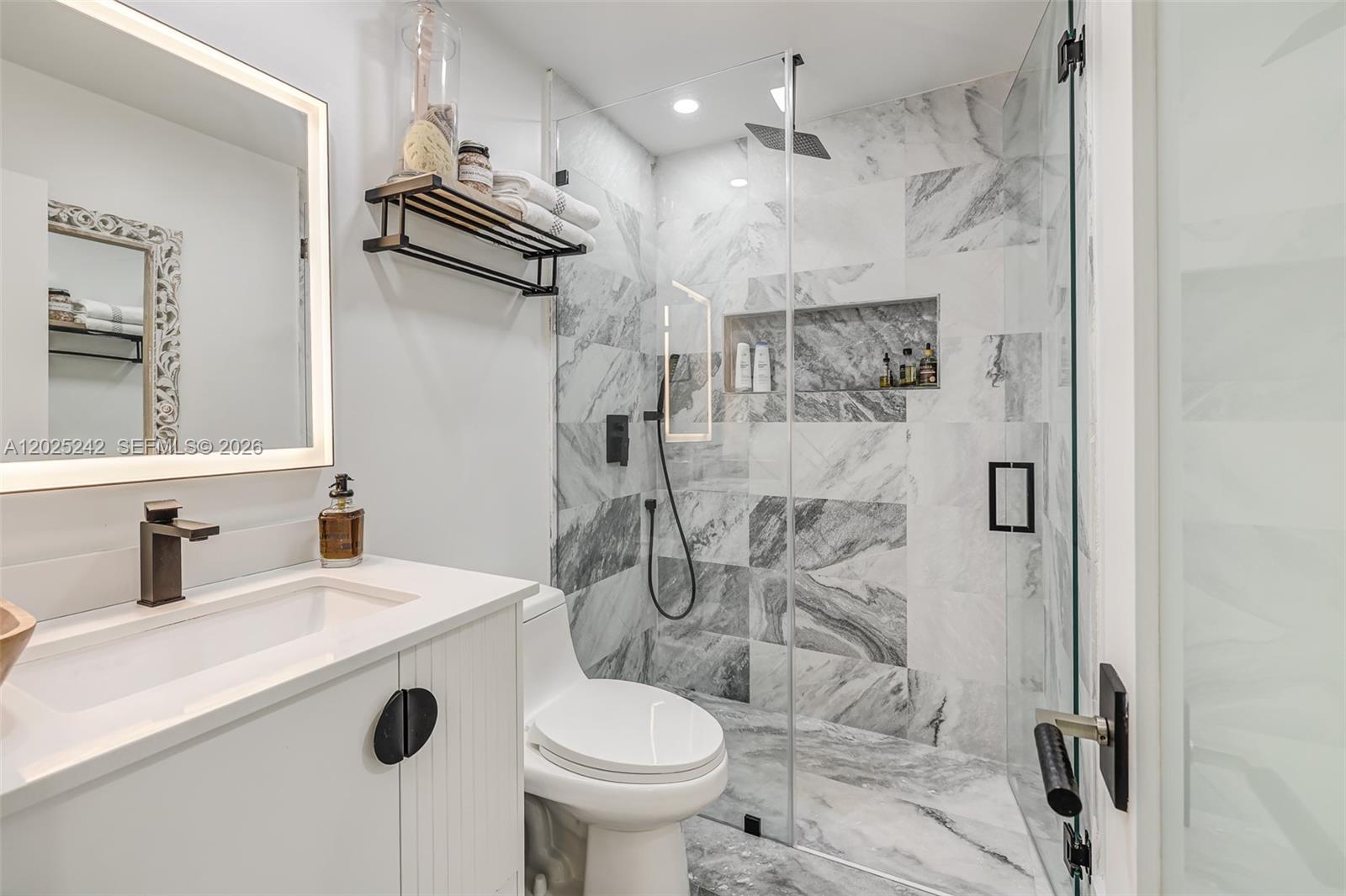 8761 Southwest 56th Street Miami, FL 33165 - Photo 40 of 90 a bathroom with a sink toilet and shower