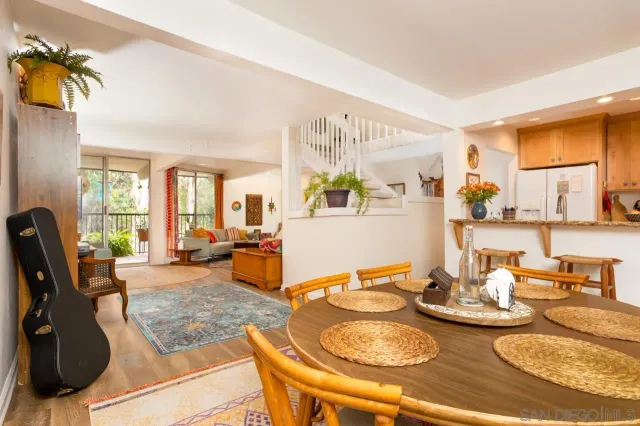 a dining room with furniture and wooden floor