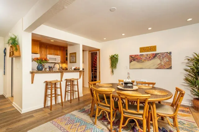 a kitchen with stainless steel appliances granite countertop a stove a refrigerator and a microwave