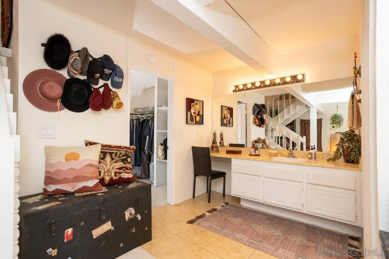 2412 Altisma Way, Unit D Carlsbad, CA 92009 - Photo 26 of 46 a view of living room with furniture and flat screen tv