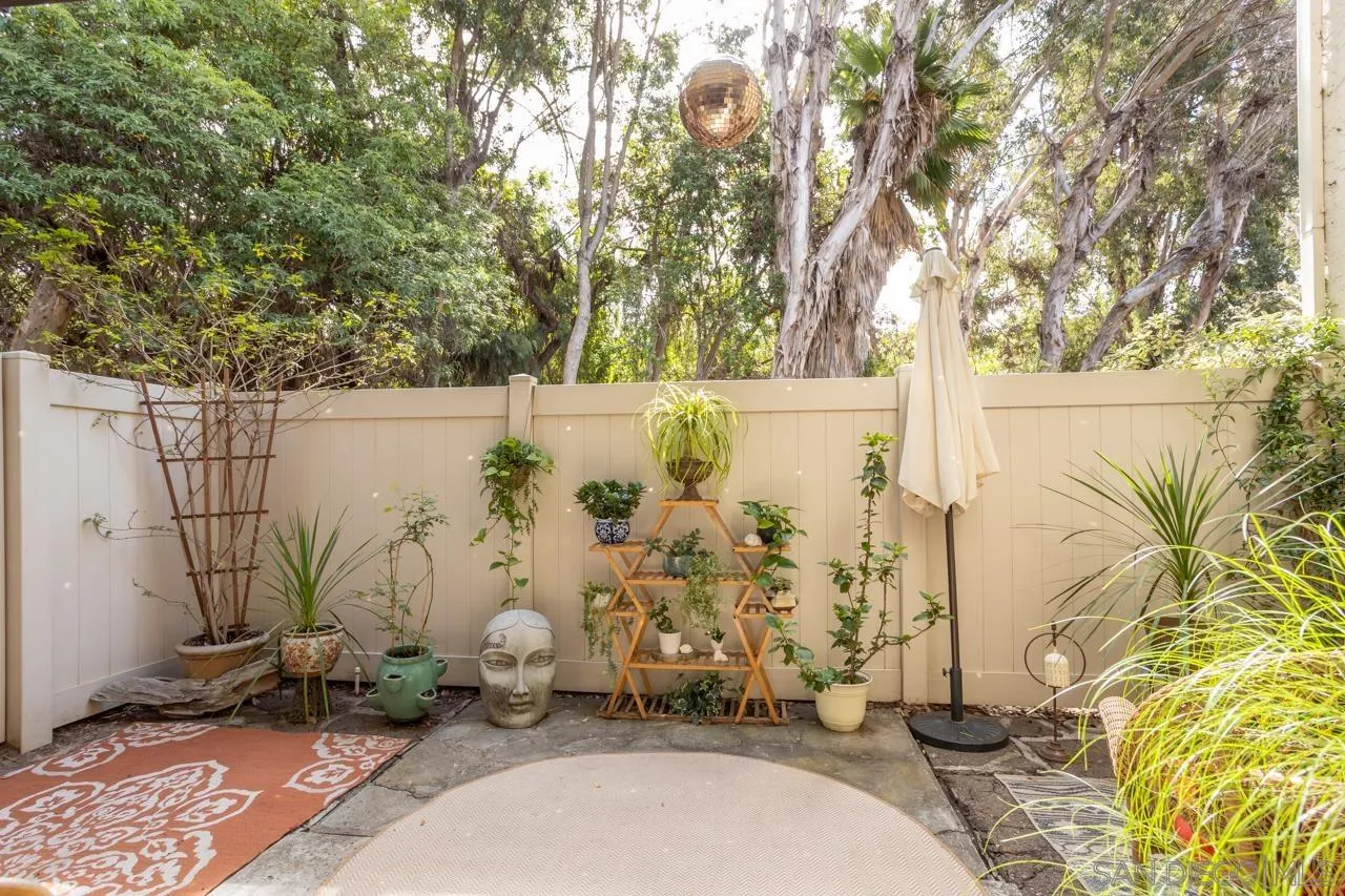 2412 Altisma Way, Unit D Carlsbad, CA 92009 - Photo 31 of 46 a view of outdoor space water fountain and trees